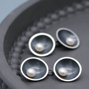 Art Deco inspired black pearl cufflinks with double-sided chain design and genuine freshwater pearls.