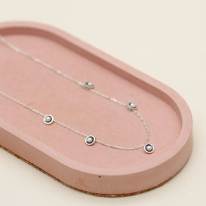 Handmade mini pearl necklace crafted in oxidised sterling silver with evenly spaced freshwater pearls along the chain.