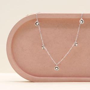 Layering pearl necklace with five genuine freshwater pearls on an adjustable 16 to 18 inch sterling silver curb chain.