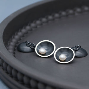 Close up of handmade double-sided pearl cufflinks showing oxidised sterling silver and natural freshwater pearls.