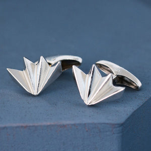Pair of fan-shaped art deco cufflinks on deep blue background, modern men’s silver cufflinks ideal for groom or best man gift