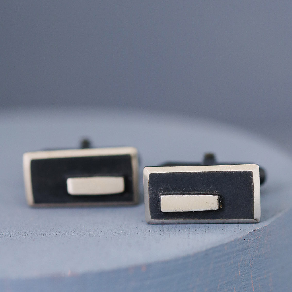 Detailed shot of the oxidised black finish on the cufflinks, paired with polished silver highlights — timeless special gift for husband’s birthday.