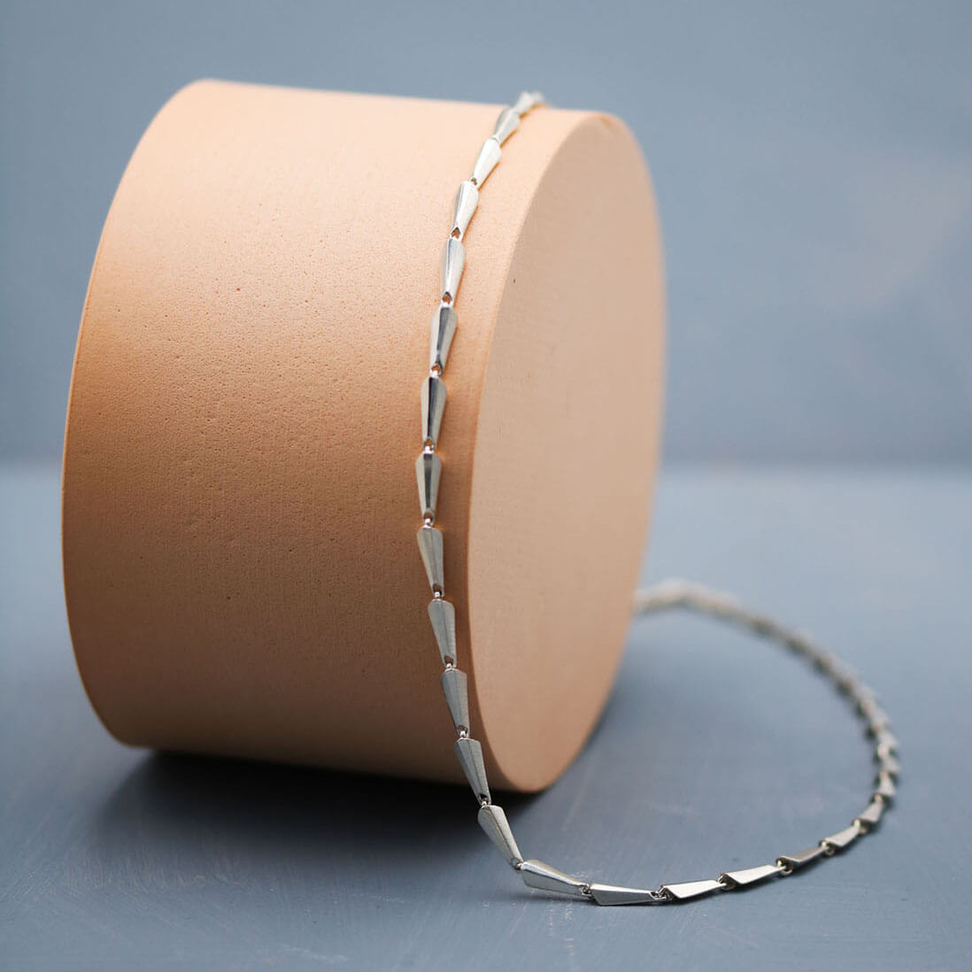 Silver link necklace close-up showing the clean geometric lines and contemporary Art Deco-inspired design