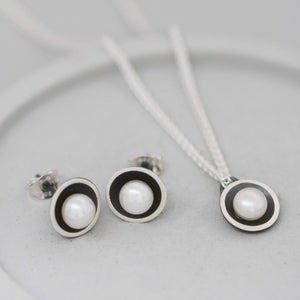 Black pearl stud earrings photographed with matching black pearl necklace for coordinating jewellery set