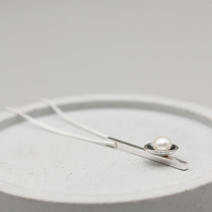 Elegant black pearl bar necklace with a 5mm freshwater pearl and sleek sterling silver bar pendant.