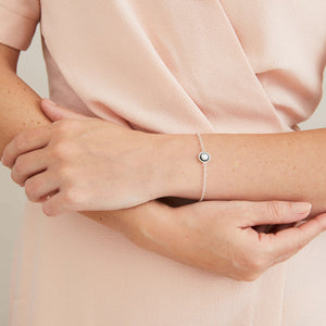 Real pearl bracelet for women worn as a stacking bracelet alongside other sterling silver jewellery, showing its delicate contemporary design.