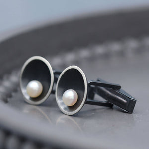Detailed view of freshwater pearl cufflinks highlighting the natural lustre and unique character of each pearl.