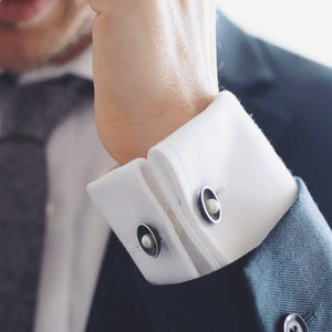 Double-sided pearl cufflinks worn on a white shirt, featuring genuine freshwater pearls and Art Deco inspired styling.
