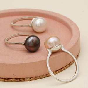 Pearl statement rings featuring white, peach and peacock freshwater pearls