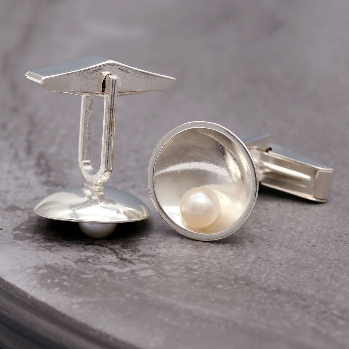 Handmade freshwater pearl cufflinks for men with classic sterling silver setting and timeless design.