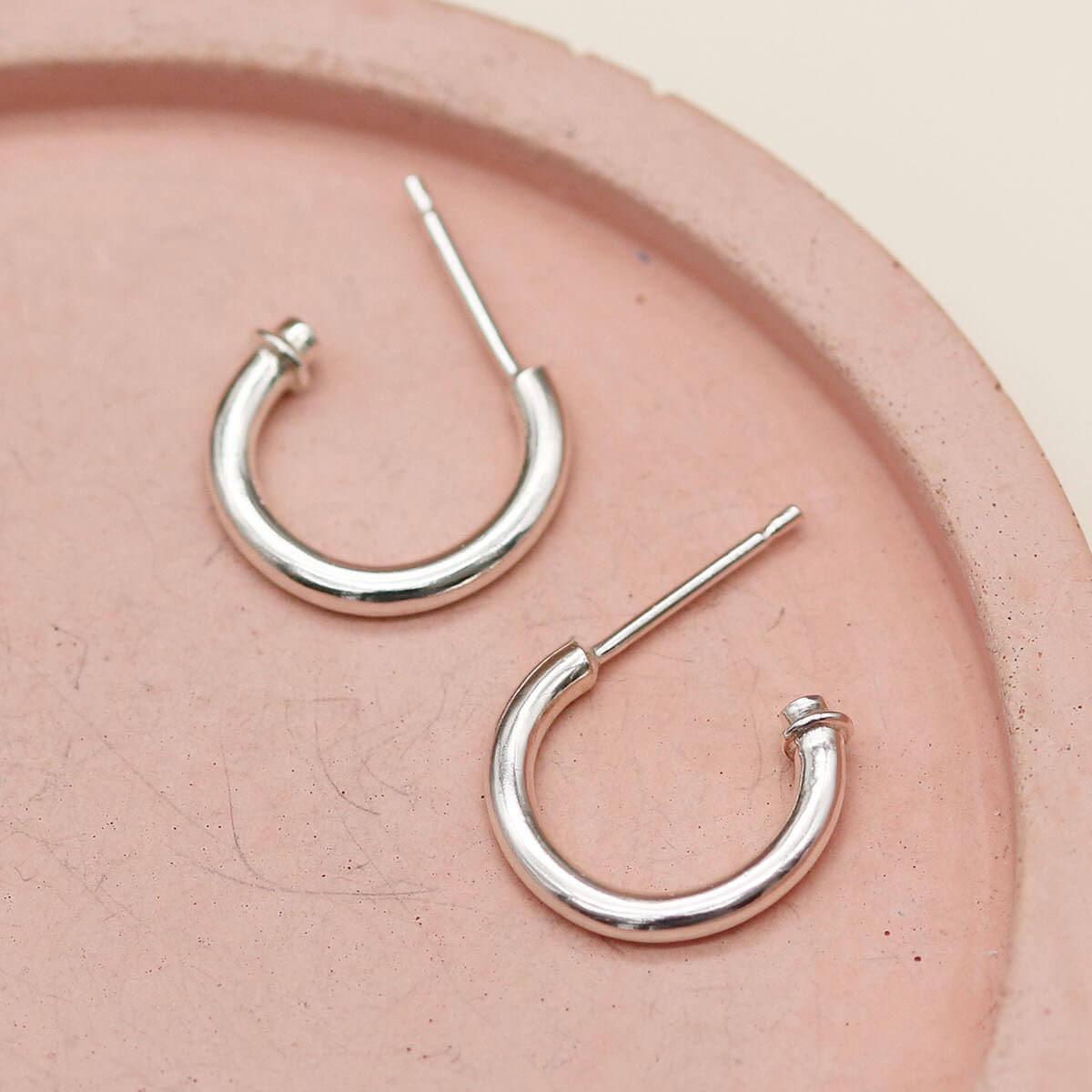 Handmade pearl drop hoop earrings crafted from solid sterling silver with genuine freshwater pearl charms.