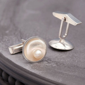 Handmade sterling silver cufflinks with freshwater pearls inspired by the elegance of Art Deco design.