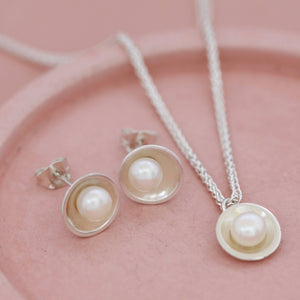 Pearl silver stud earrings pictured with matching sterling silver pearl necklace, presented as a coordinated jewellery gift set.
