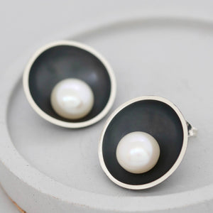 Black pearl stud earrings handcrafted in sterling silver with a freshwater pearl