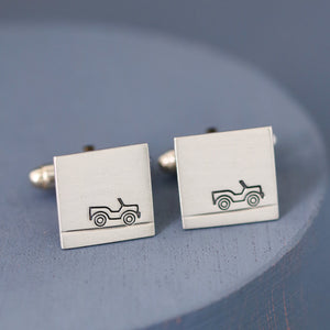 Up-close detail of car design hand-stamped on the silver surface, showcasing craftsmanship and perfect as a gift for car lovers.