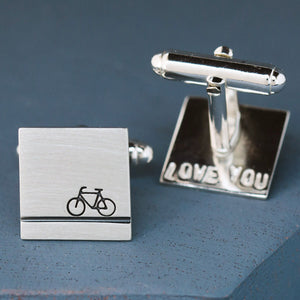 Bike cufflinks displayed on deep blue fabric, ideal cycling gifts for him who loves bikes or wants a unique handmade keepsake.