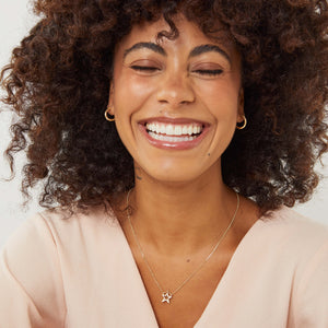 9ct hoop earrings modelled close up, real gold small hoop earrings minimalist look