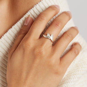 Art Deco silver ring worn on a woman's hand, showing how the geometric fan shape creates a distinctive statement look