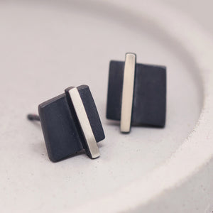 Silver and black earrings displayed on a grey dish showing the geometric square design, ideal birthday gift for her.