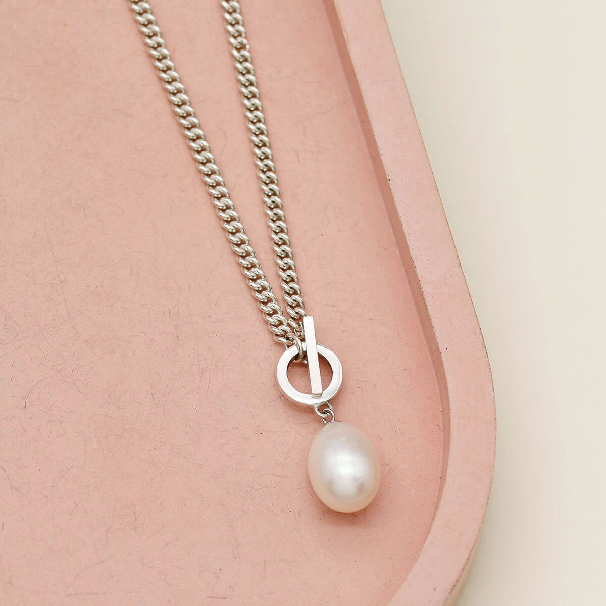 Big pearl necklace featuring a polished sterling silver curb chain and a naturally lustrous freshwater pearl.