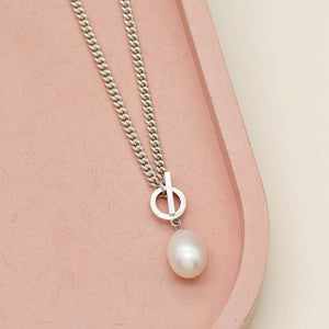 Big pearl necklace featuring a polished sterling silver curb chain and a naturally lustrous freshwater pearl.