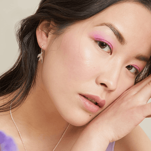 Art deco drop earrings modelled with soft waves, highlighting the bold fan shape; perfect anniversary or Valentine’s gift.