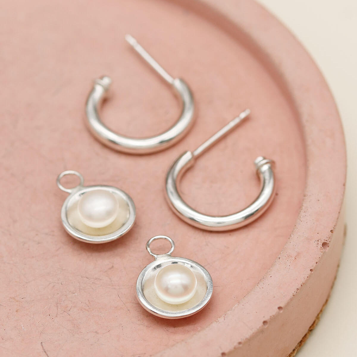 Handmade silver hoop earrings with pearls crafted from sterling silver with removable freshwater pearl drops.