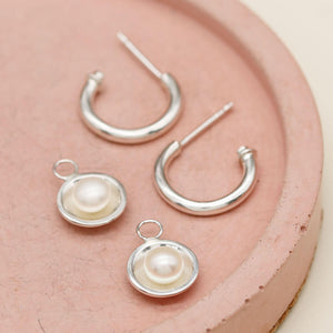 Handmade silver hoop earrings with pearls crafted from sterling silver with removable freshwater pearl drops.