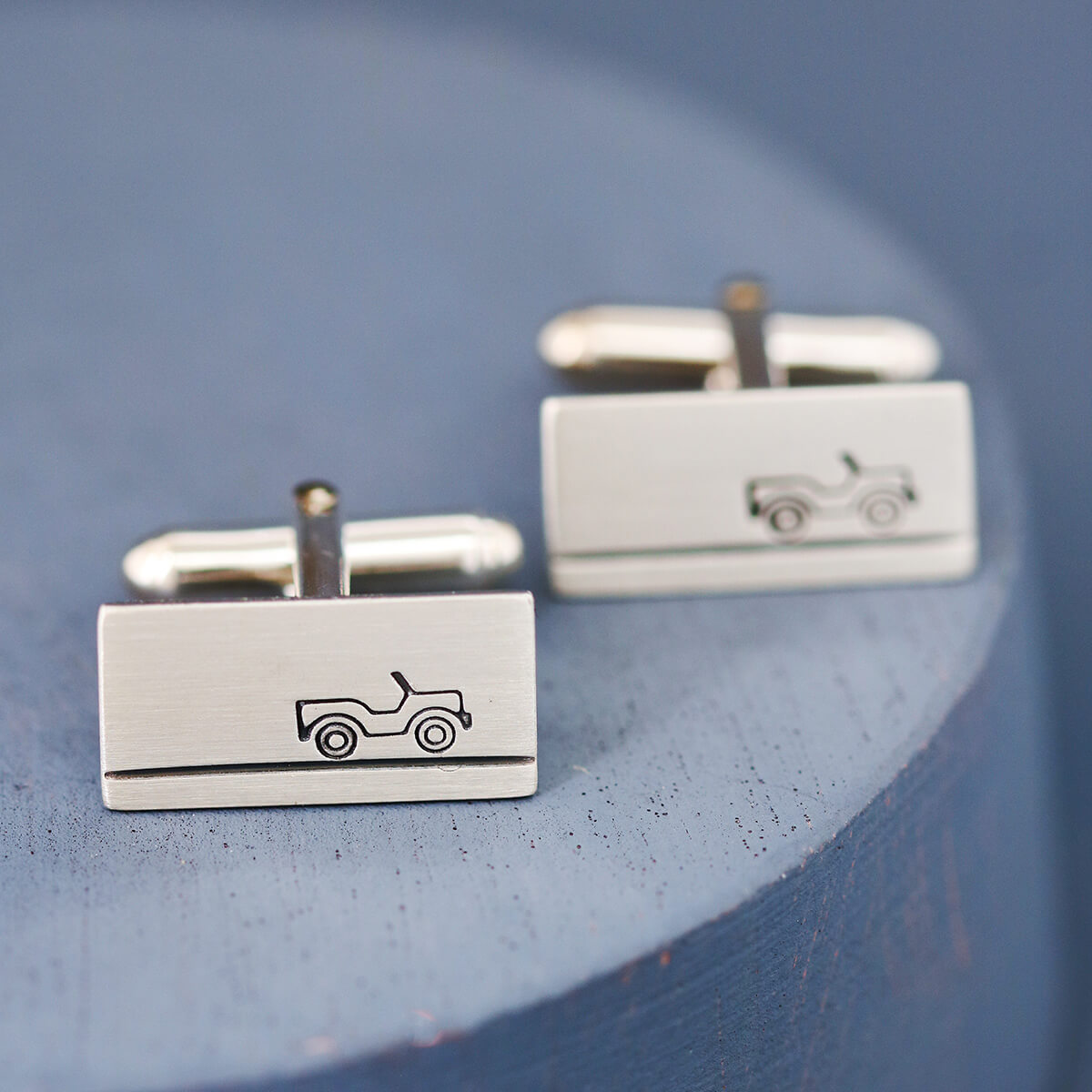 Pair of solid silver land rover cufflinks with detailed stamp design, ideal personalised car enthusiast gifts presented in Louy Magroos gift box.