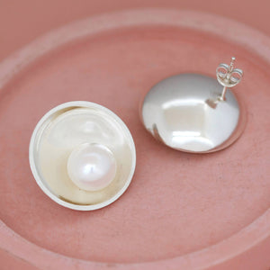 Sterling silver pearl stud earrings with asymmetrical freshwater pearl detail