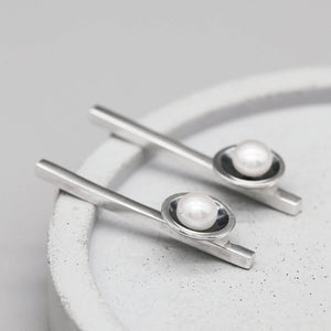 Handmade oxidised sterling silver pearl earrings with genuine freshwater pearls in a modern geometric design.