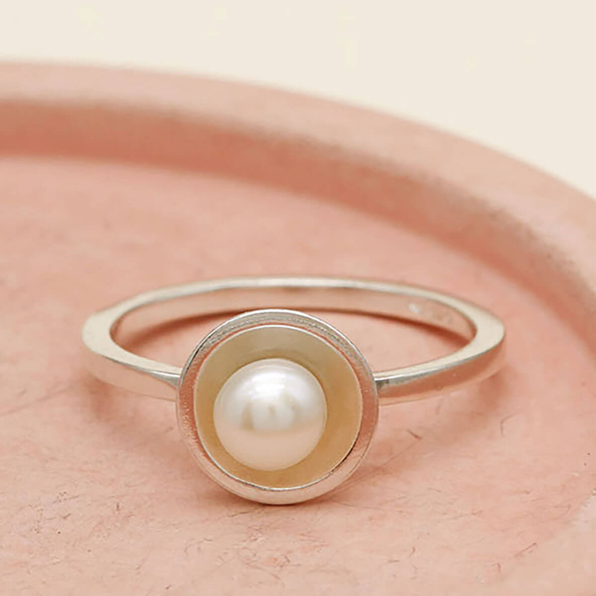 Handmade pearl stacking rings in sterling silver and oxidised silver finishes