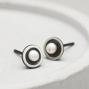 Handmade black sterling silver pearl stud earrings showcasing delicate 3mm freshwater pearls and polished domed settings.