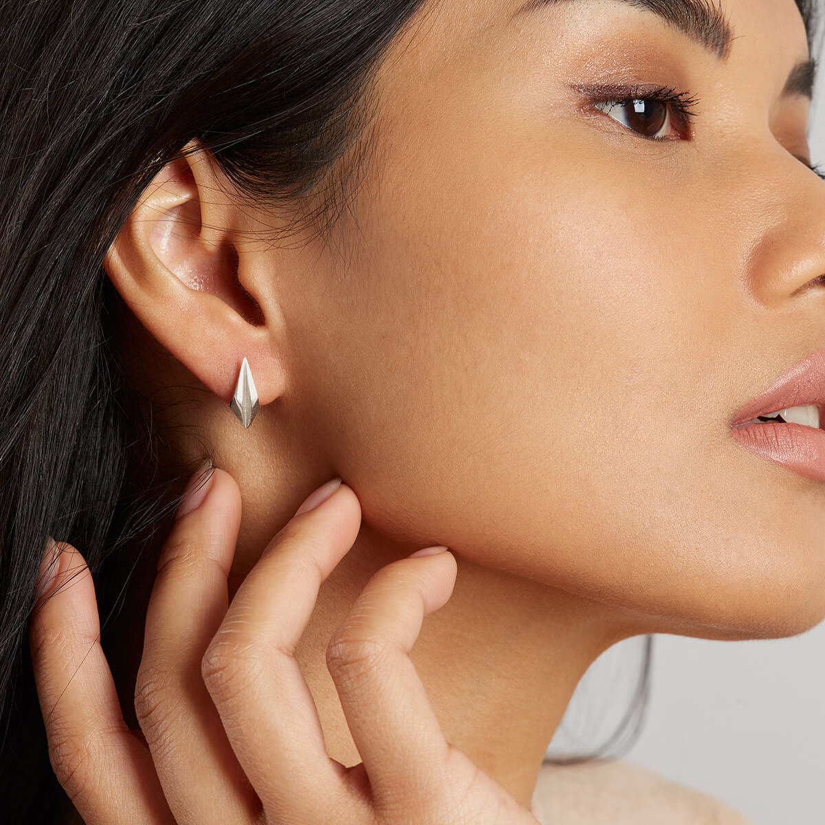 Silver art deco earrings styled on model for everyday wear or Art Deco bridal jewellery.