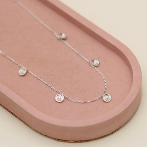 Handmade sterling silver pearl chain necklace highlighting five petite freshwater pearls in an elegant Art Deco inspired design.