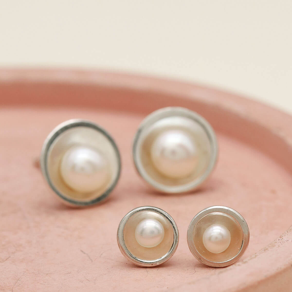 Small sterling silver pearl studs compared with the Classic size pearl earrings