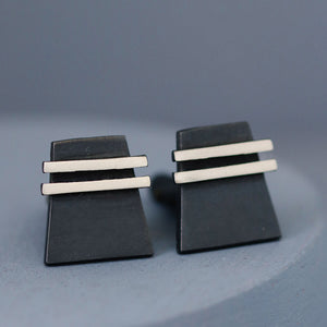 Up-close detail of one black cufflink focusing on the oxidised finish. Great gift for husband or men who appreciate sleek modern design.