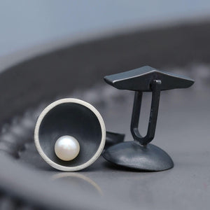 Black pearl cufflinks with Art Deco styling, handcrafted in sterling silver and hallmarked in the UK.