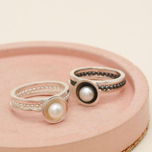 Freshwater pearl ring set shown alongside the oxidised silver stacking ring version