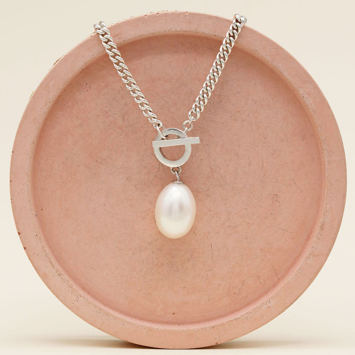 Close up of a handmade big pearl necklace crafted in solid sterling silver with a genuine freshwater pearl.