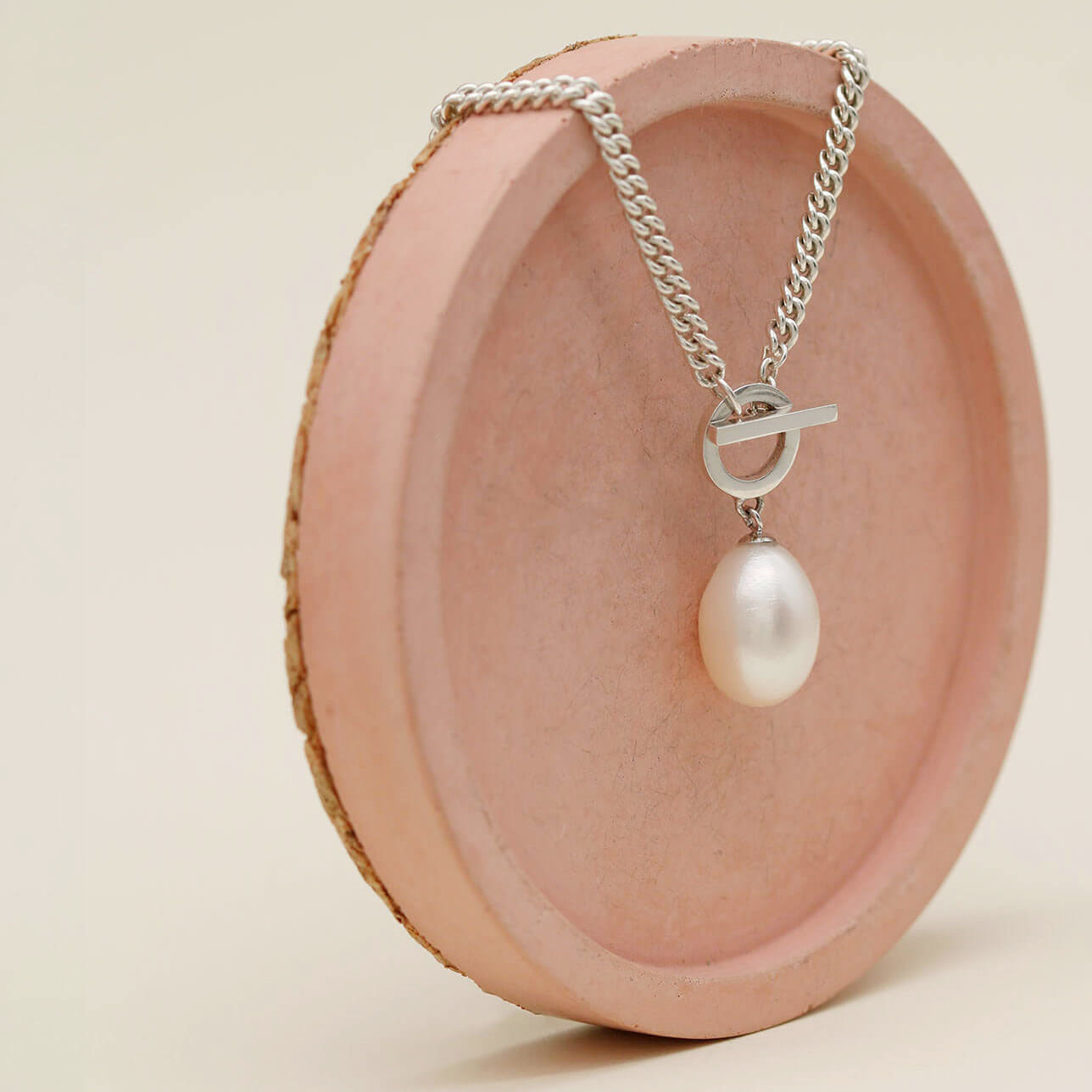 Handmade sterling silver necklace with front toggle fastening and a genuine freshwater pearl in an Art Deco inspired design.