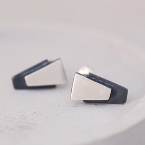 Small black stud earrings for women on grey dish, sterling silver design suitable for bridal jewellery or bridesmaid gifts.