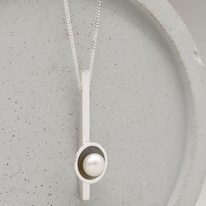 Black pearl bar necklace showcasing an oxidised sterling silver pendant with genuine freshwater pearl.