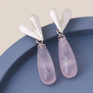 Elegant heart dangle earrings in sterling silver with rose quartz, romantic Pink heart earrings photographed on a blue dish