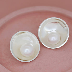 Handmade silver pearl stud earrings with polished domed silver setting