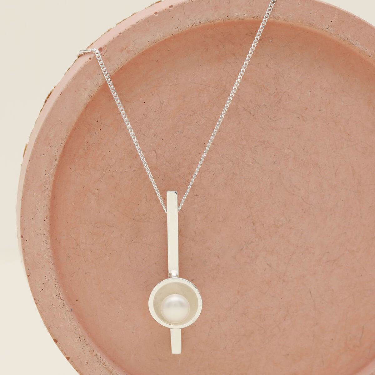 Handmade sterling silver pearl bar necklace with a genuine freshwater pearl on a fine diamond-cut silver chain.