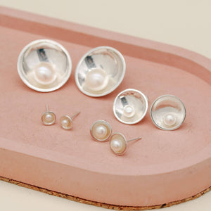 Petite, Classic, Signature and Statement sterling silver pearl earrings shown together for size comparison