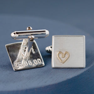 Close-up of one cufflink showing the 9ct gold heart detail and smooth matte silver finish — thoughtful gift for husband.