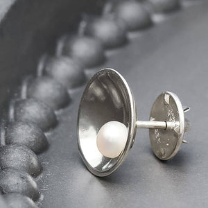 Sterling silver pearl tie pin featuring a polished freshwater pearl and elegant Art Deco inspired design.