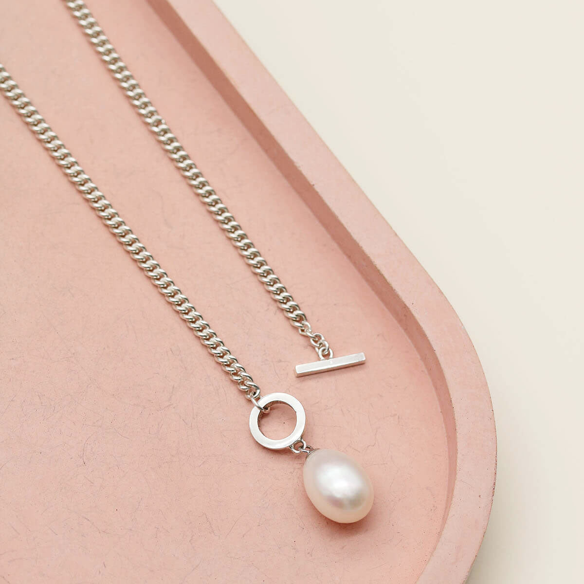 Sterling silver toggle pearl necklace featuring a polished T-bar clasp and a large 12mm freshwater pearl pendant.